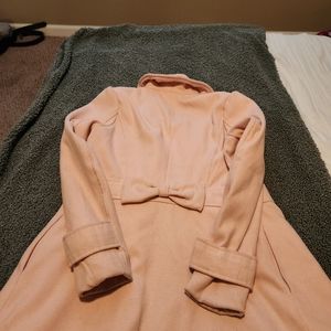 Small Charlotte Russe BABY PINK button up coat with fashion bow .